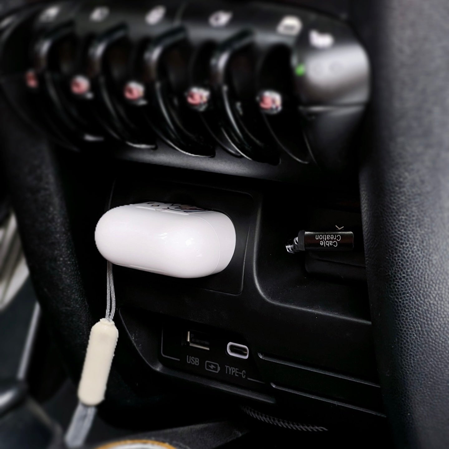 Side view of the MINI Cooper charging compartment, highlighting its compact and easy-to-install design.