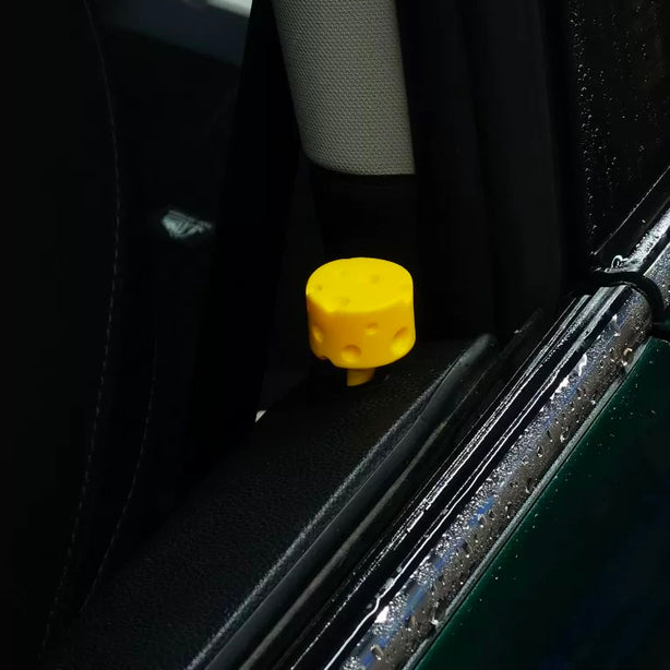 Cheese-inspired door lock pin installed in a MINI Cooper F56, showcasing its playful and quirky design.