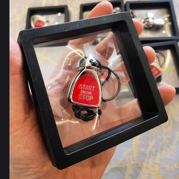 Close-up of the MINI Cooper ignition button keychain, showcasing its true replica design and premium alloy finish.