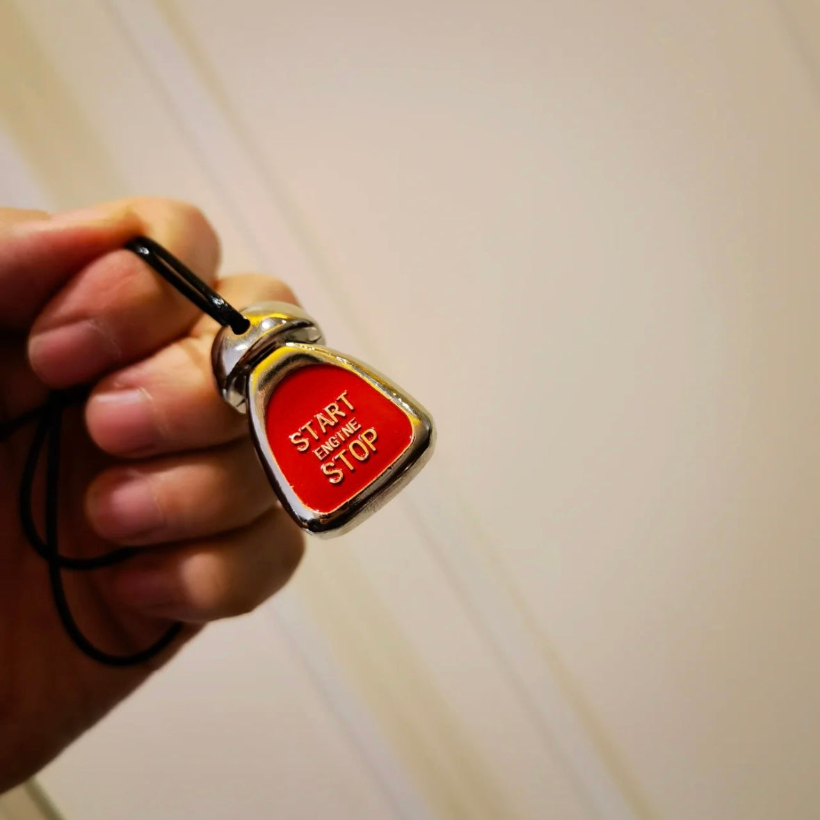MINI Cooper ignition button keychain attached to a keyring, adding a stylish touch to your keys.