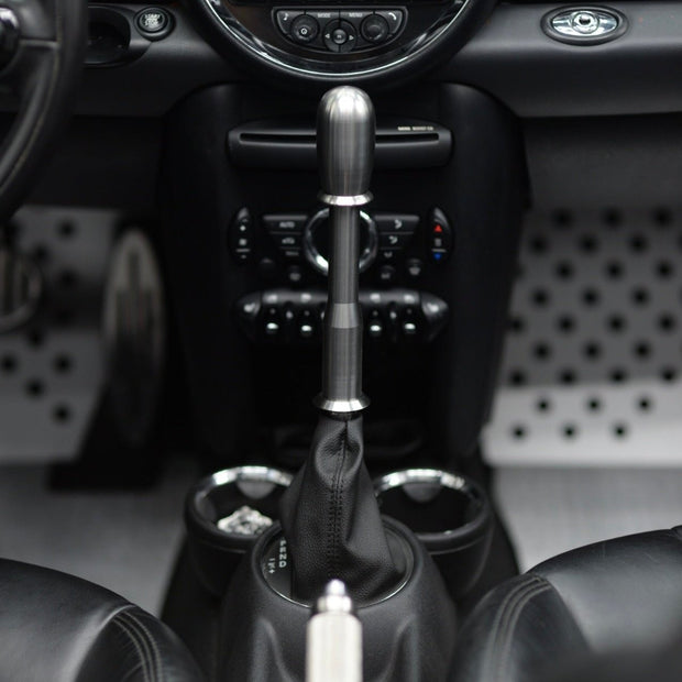 Long shifter extension kit installed in a MINI Cooper R53, showcasing its sleek design and improved grip.