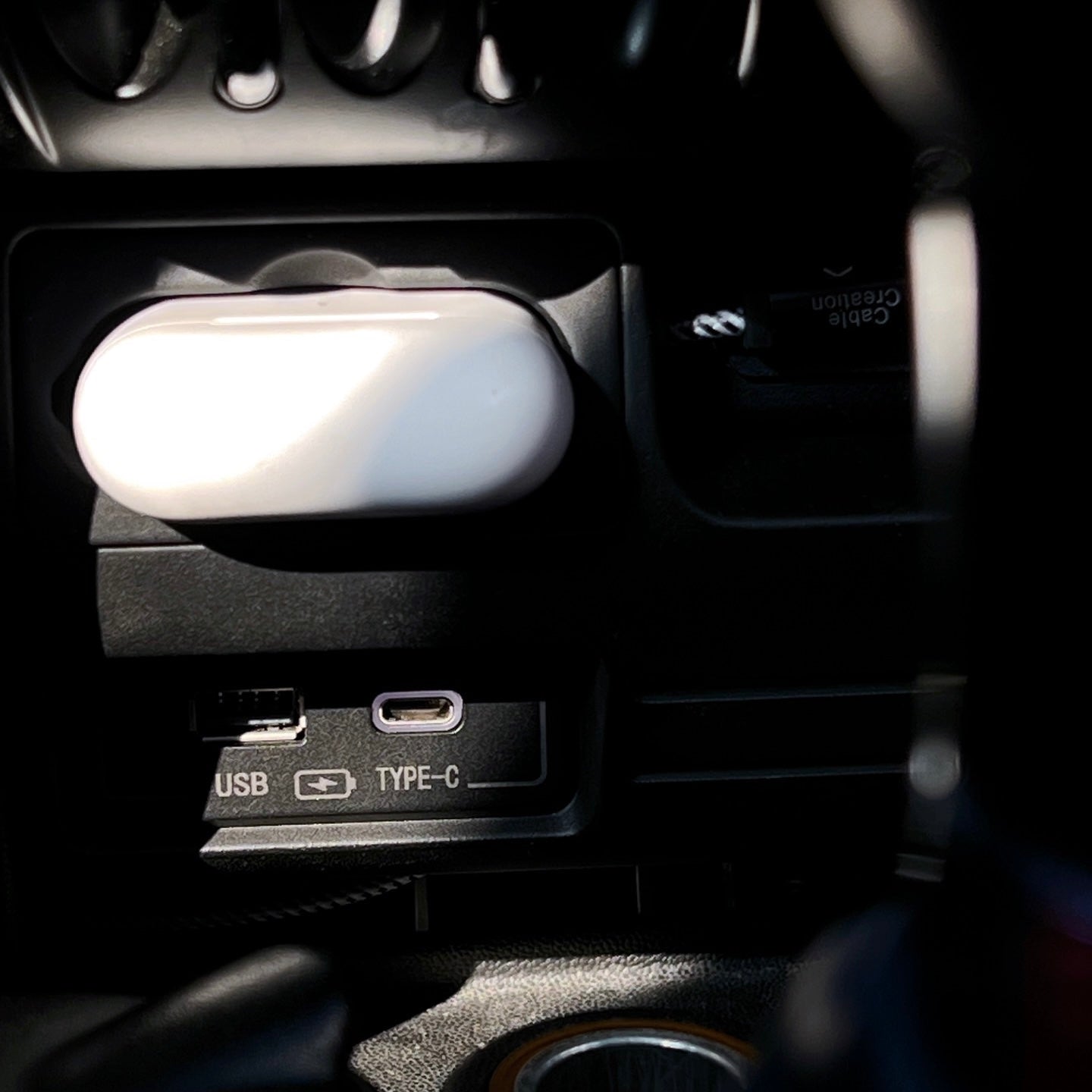 USB and Type-C charging ports installed in a MINI Cooper R56, providing fast charging for your devices.