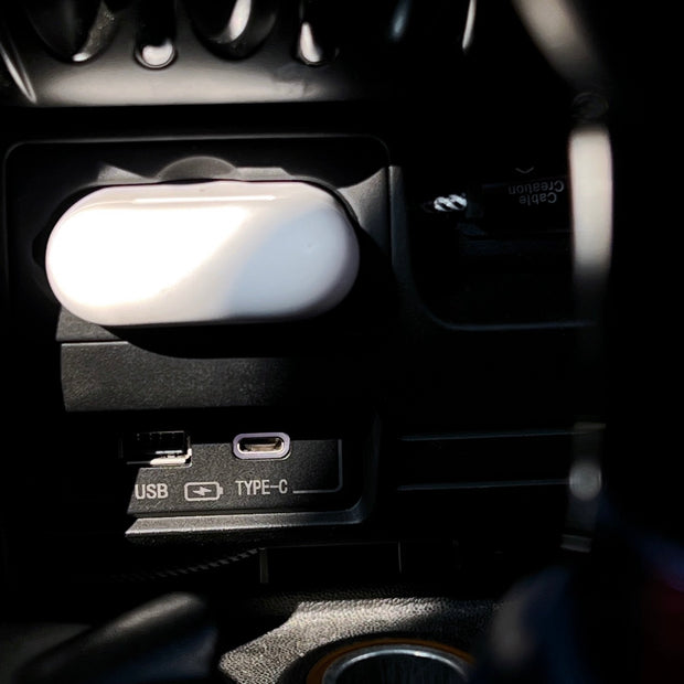 USB and Type-C charging ports installed in a MINI Cooper R56, providing fast charging for your devices.