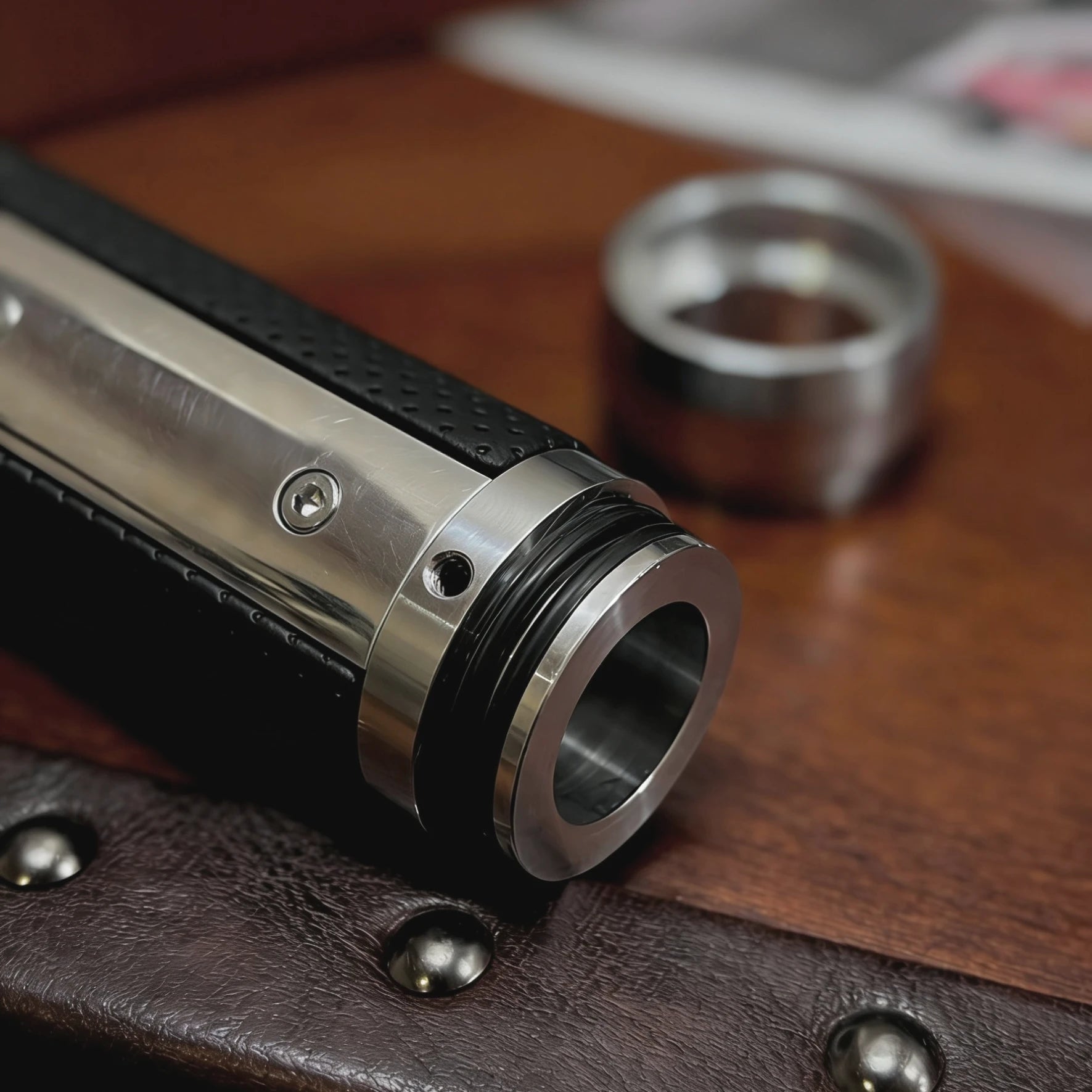 Close-up of perforated leather grip and anodized aluminum handbrake handle