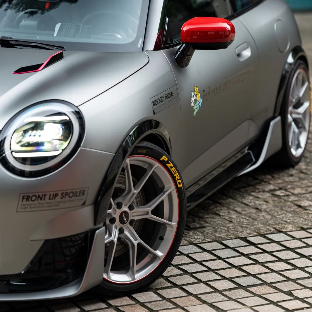 MINI J01 Cooper Electric hatchback with dry carbon splitter, skirts, and mirror covers