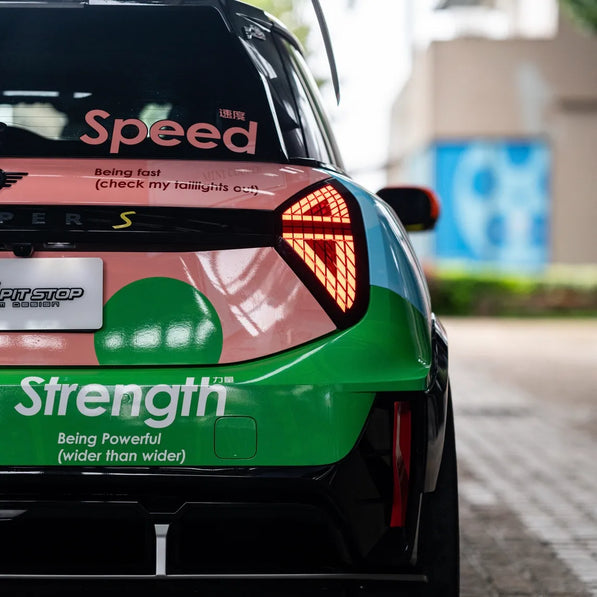 Rear view of MINI JCW J01 Electric with dry carbon spoiler, bumper decor, and diffuser