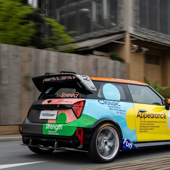 MINI JCW J01 Electric fitted with dry carbon side skirts, hood canards, and splitter