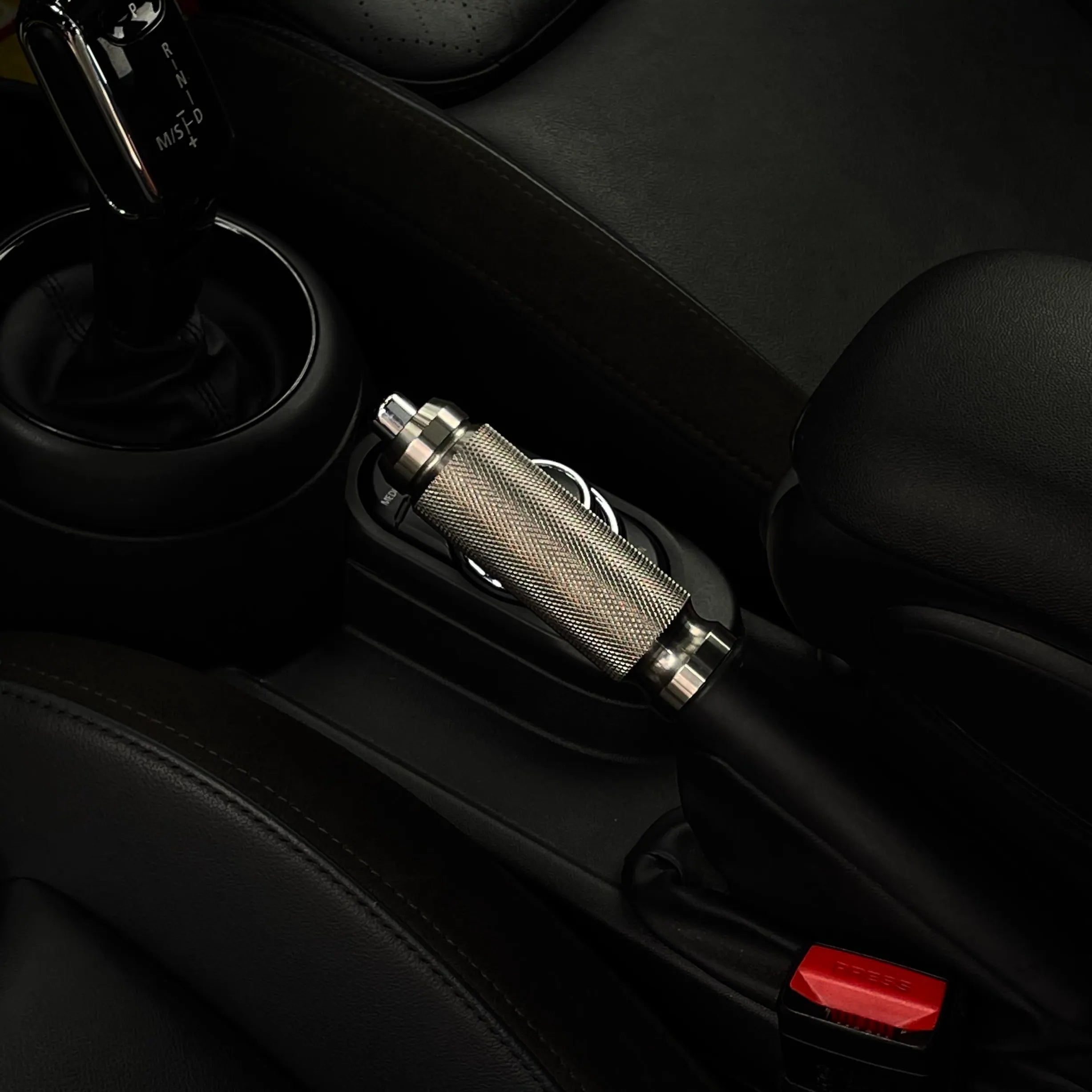 MINI JCW handbrake lever in stainless steel, crafted for R-Series and F-Series MINI models, providing a sleek, sporty interior upgrade.