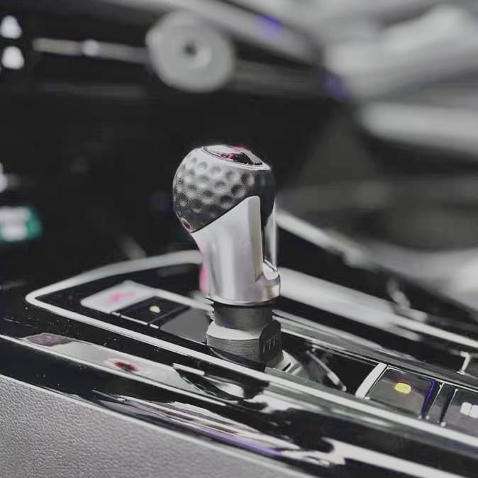 Detailed close-up of DSG shift knob extension on VW GTI MK8

