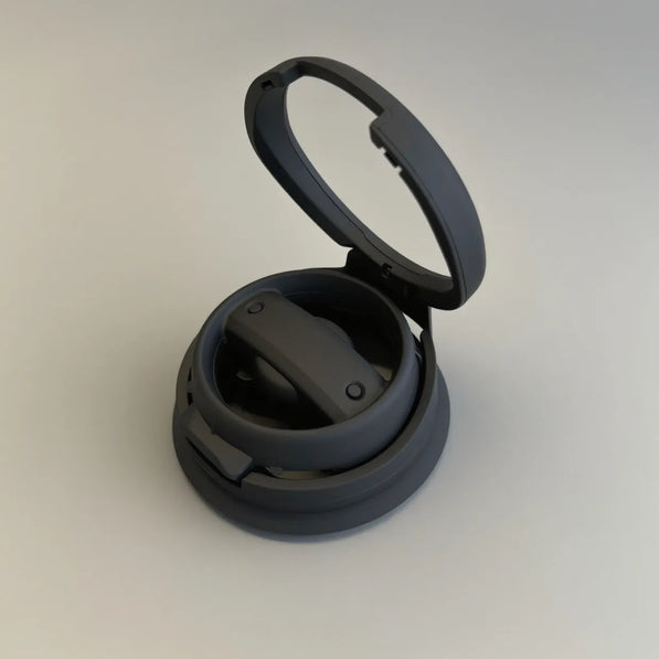 Matte black cup holder installed on driver side of Mini Cooper F56