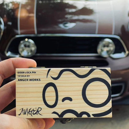 Bullet-inspired door lock pin presented in a small wooden gift box, perfect for MINI enthusiasts.