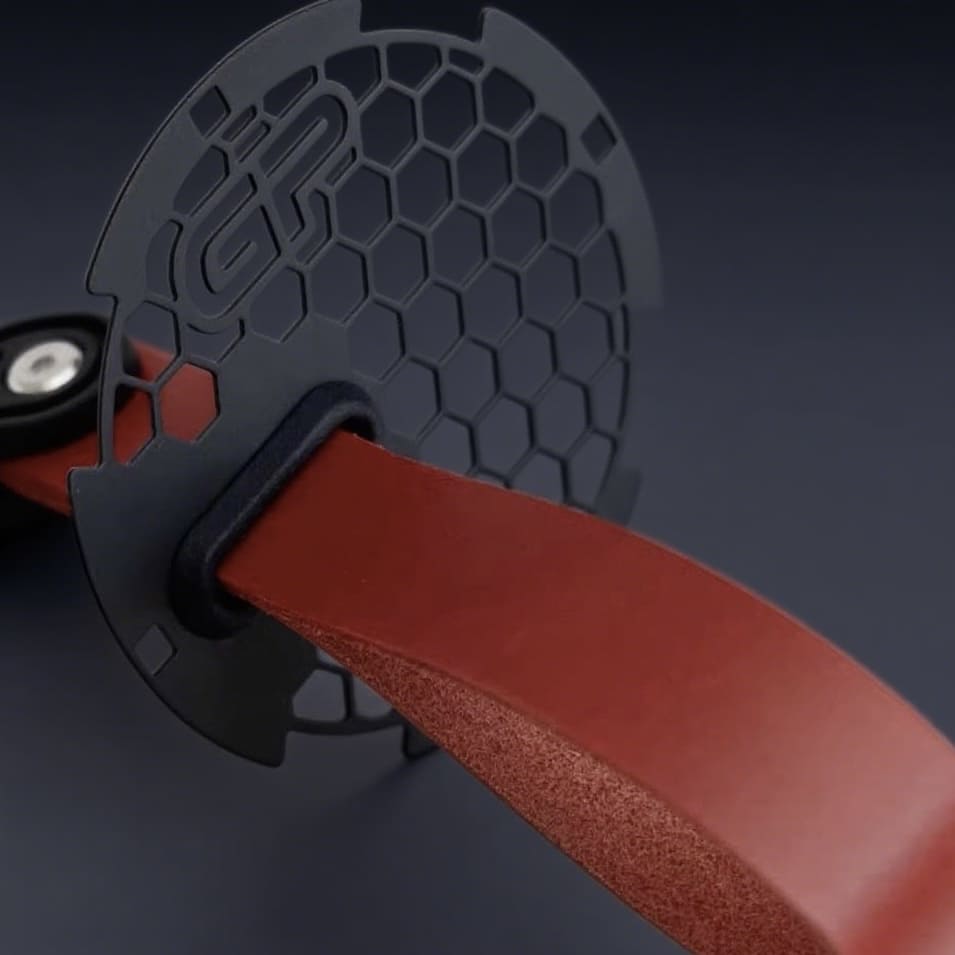 MINI Cooper R56 door panel showing motorsport-style red handle pull RS strap.