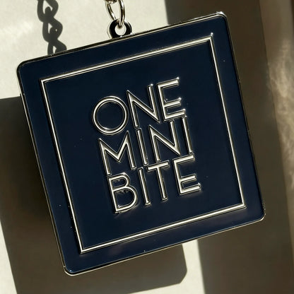ONEMINIBITE square keyring with size comparison showing 5 cm (1.97 inch) dimensions