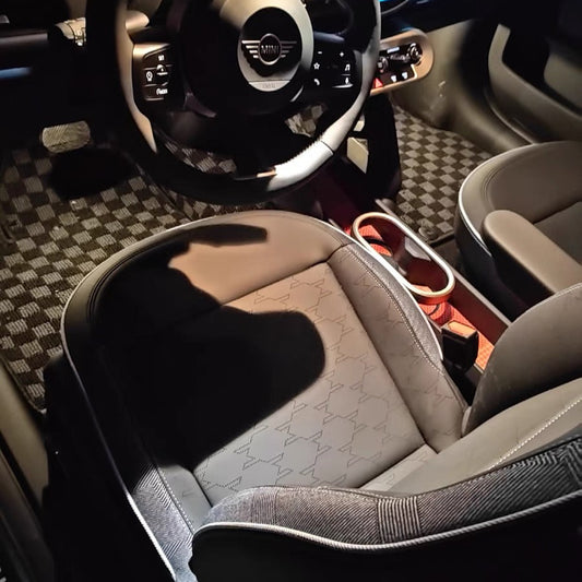 Racing-style checkered floor mats for 2025 MINI Cooper Electric (J01) and Petrol (F66) models.