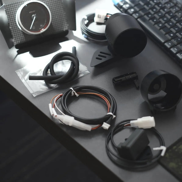 Installed gauge pod on VW Golf MK8 GTI displaying AEM boost gauge, racing-inspired design, performance upgrade alternative to CJM and AeroForce pods