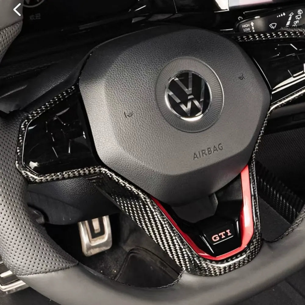 Genuine carbon fiber steering wheel trim for VW Golf MK8, GTI, and R models, gloss finish, OEM-fit, direct replacement, no interference with controls.