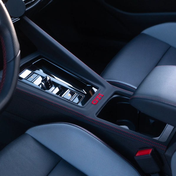 VW Golf MK8 GTI DSG leather gear shift panel cover installed, GTI logo embroidery — piano black scratch fix