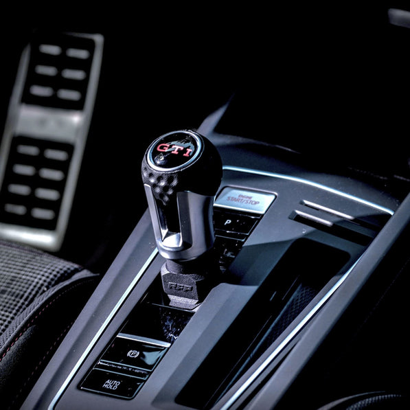 Close-up of premium gear knob extension installed on VW Golf MK8 GTI interior