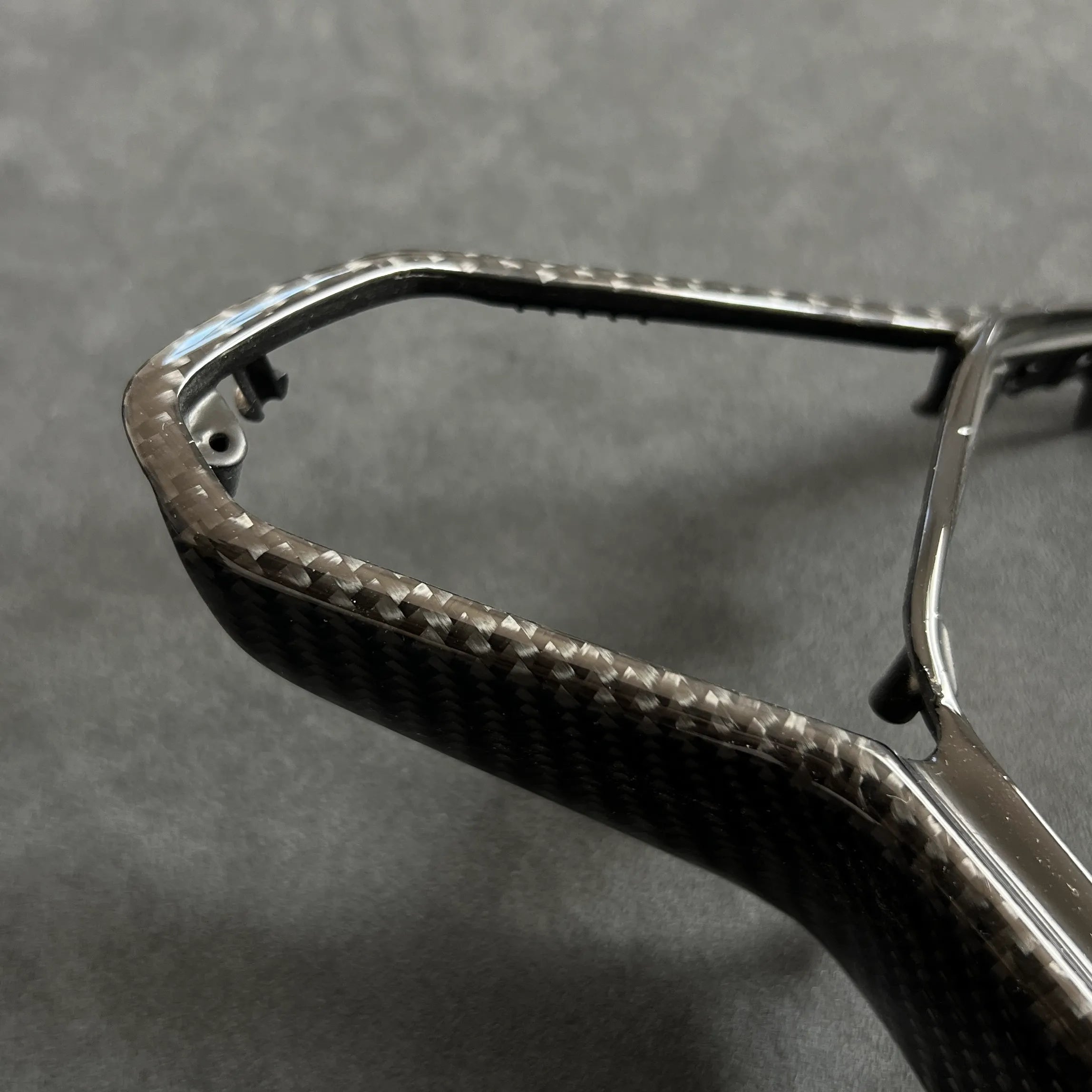 Gloss carbon fiber steering wheel trim upgrade for VW Golf MK8, GTI, and R models with haptic controls, offering a premium OEM-fit replacement.