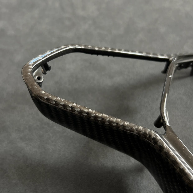 Gloss carbon fiber steering wheel trim upgrade for VW Golf MK8, GTI, and R models with haptic controls, offering a premium OEM-fit replacement.