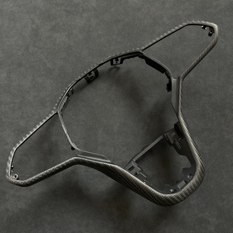 OEM+ carbon fiber steering wheel trim upgrade for VW Golf R MK8.5, designed for precise alignment and compatibility with haptic steering controls.