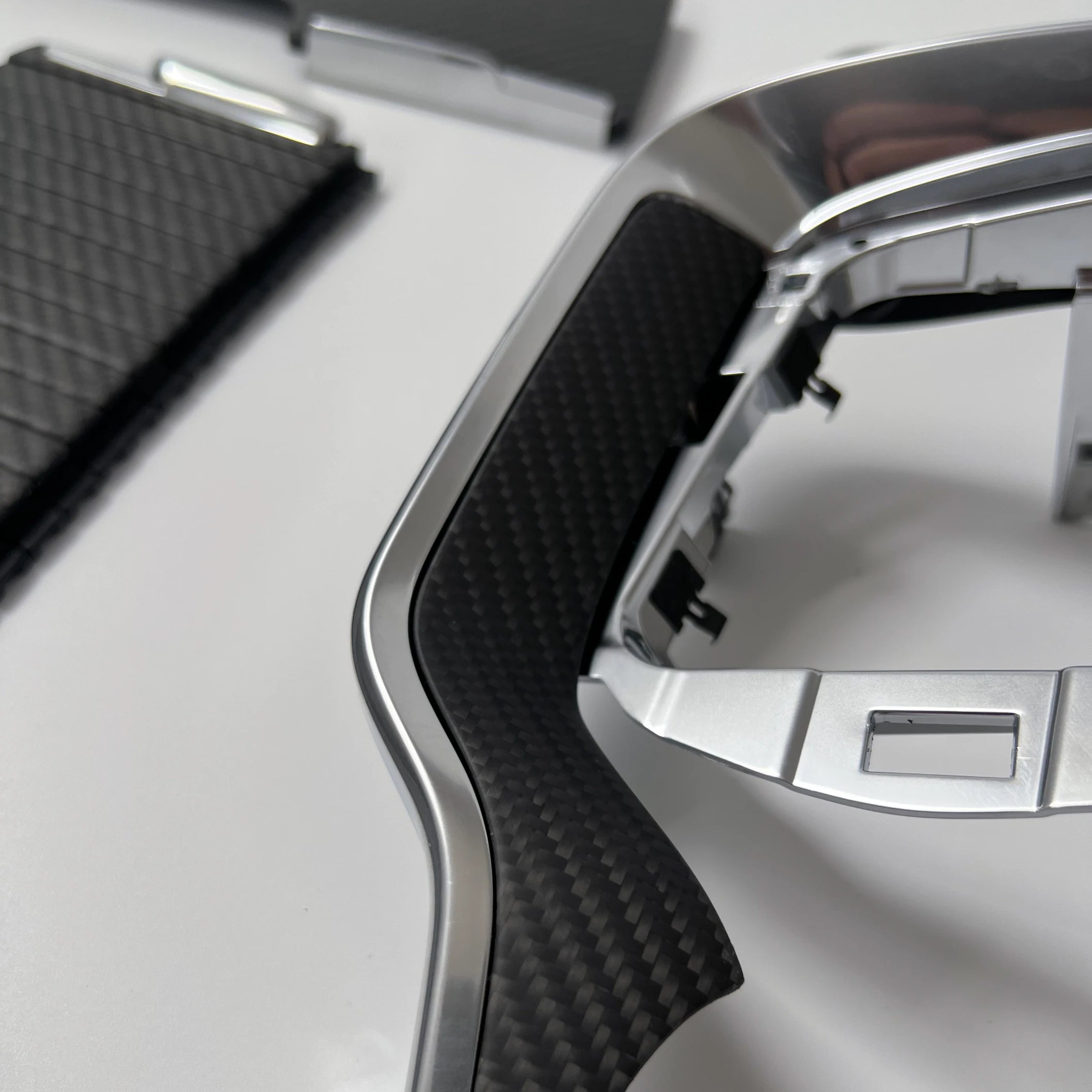 Volvo S60 V60 left air vent dash trim in matte black carbon fiber — SPA platform 2019 to present