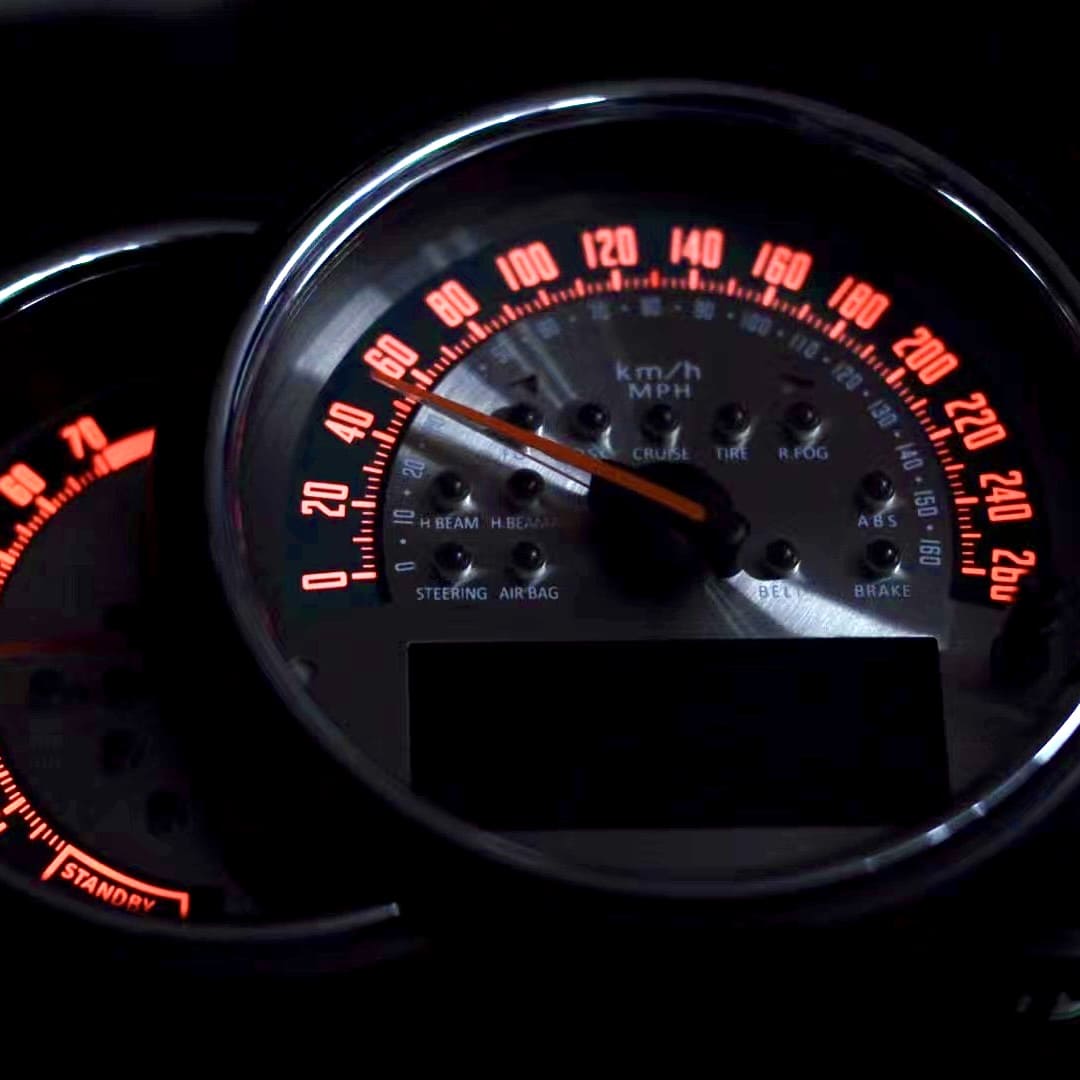 F56 MINI Cooper interior showing installed silver laser speedometer dial with green scale