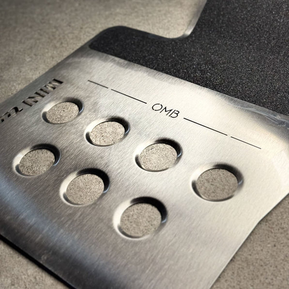 Close-up of mini cooper aftermarket parts aluminum surface on MINI Cooper F56 track mat showing texture and finish