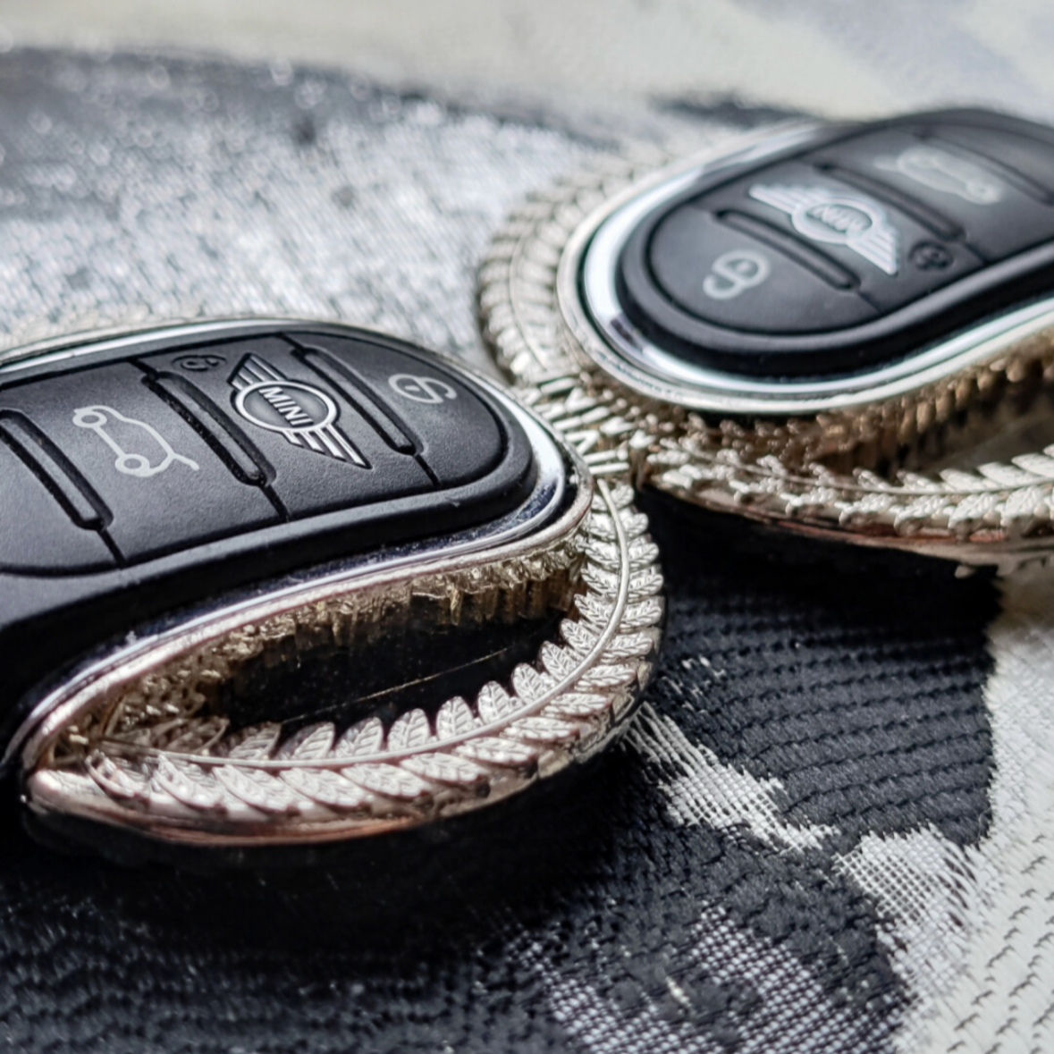 Another close-up of the alloy keyfob shell keychain installed in a Mini Cooper, showcasing its premium finish and sturdy texture