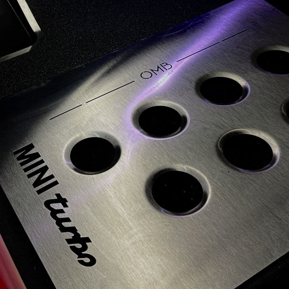 Close view of heel support area on driver side metal track mat installed in MINI Cooper