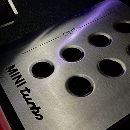 Close view of heel support area on driver side metal track mat installed in MINI Cooper