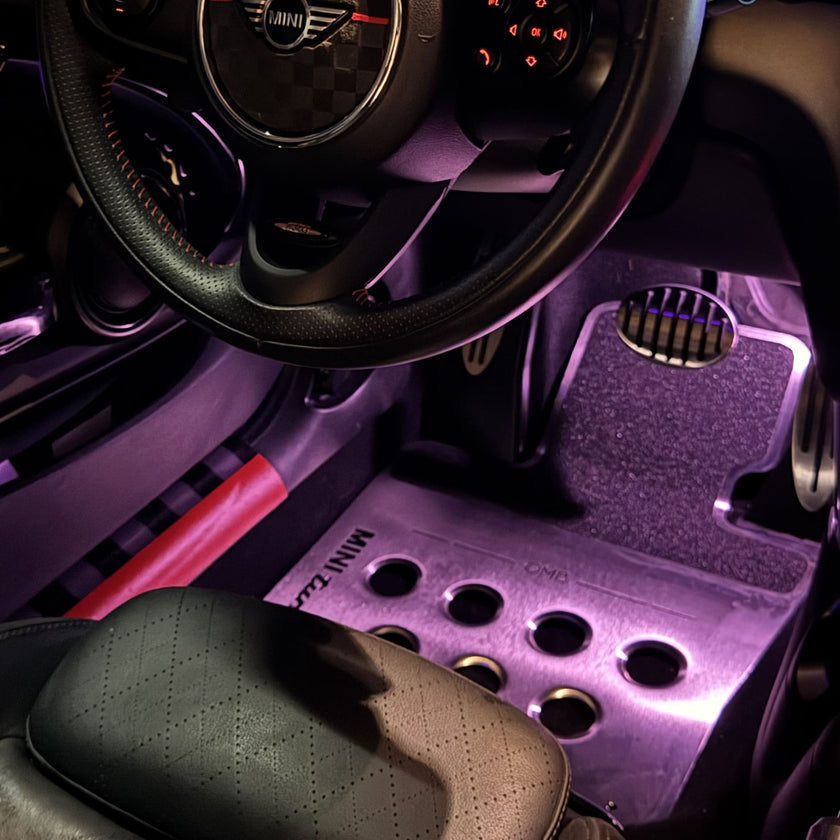 metal custom mini cooper floor mat installed in driver side footwell of MINI Cooper R56 showing clean fit and pedal area