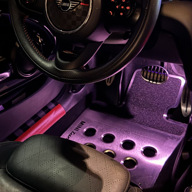 metal custom mini cooper floor mat installed in driver side footwell of MINI Cooper R56 showing clean fit and pedal area