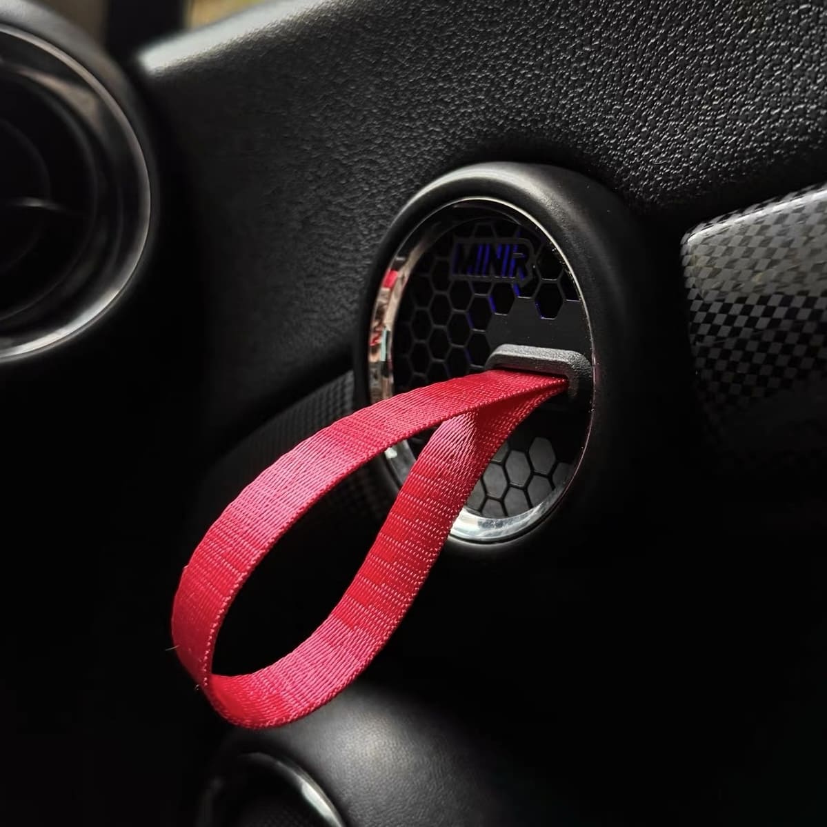 GP-style Mini Cooper RS door latch with leather strap handle installed, track-ready and stylish