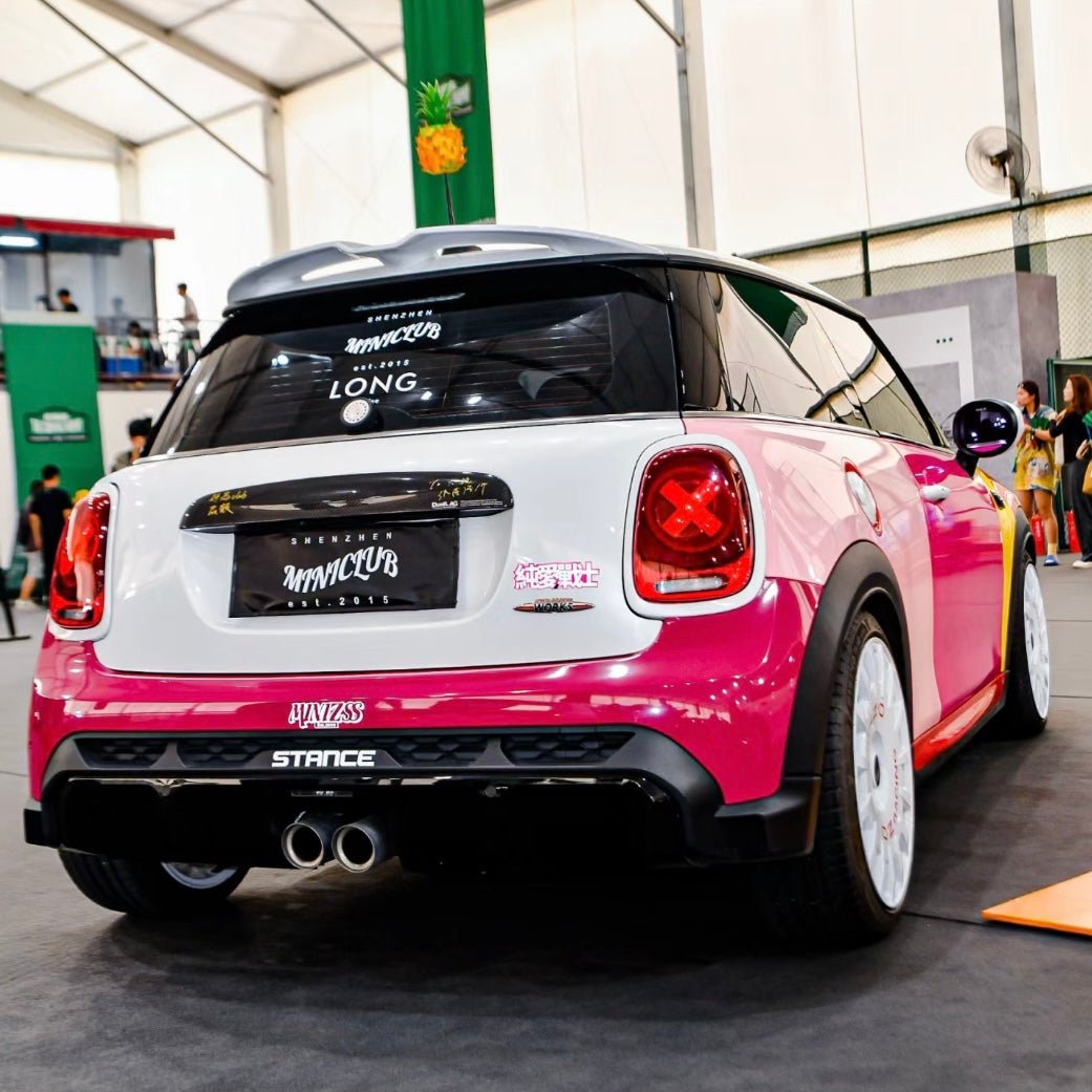 Close-up of the Unique 'X' Designers Tail Light installed on a Mini Cooper in daylight, showcasing its premium craftsmanship