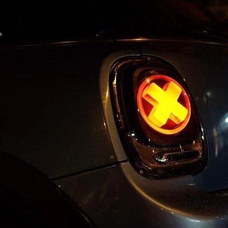 Another angle of the installed Unique 'X' Designers Tail Light illuminated at night, highlighting its unique aesthetic