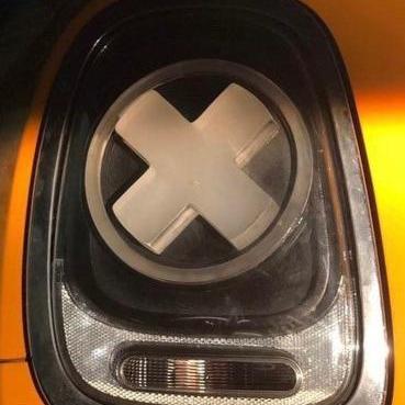 Unique 'X' Designers Tail Light unlit, displaying its elegant design and high-quality finish