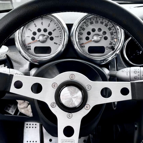 Steering hub adaptor for MINI R52 shown installed from driver’s side angle

