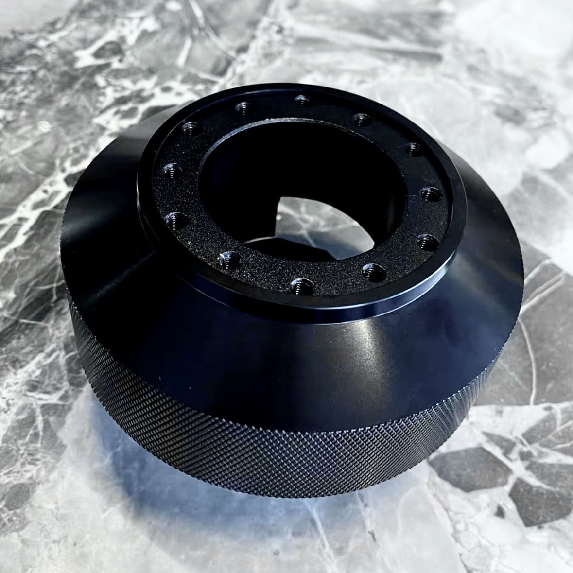 Top view of MINI Cooper R50–R53 steering hub adaptor showing aluminum finish