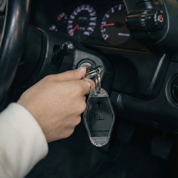 Project P P-02 automotive keychain held in hand vintage motel keyring lifestyle